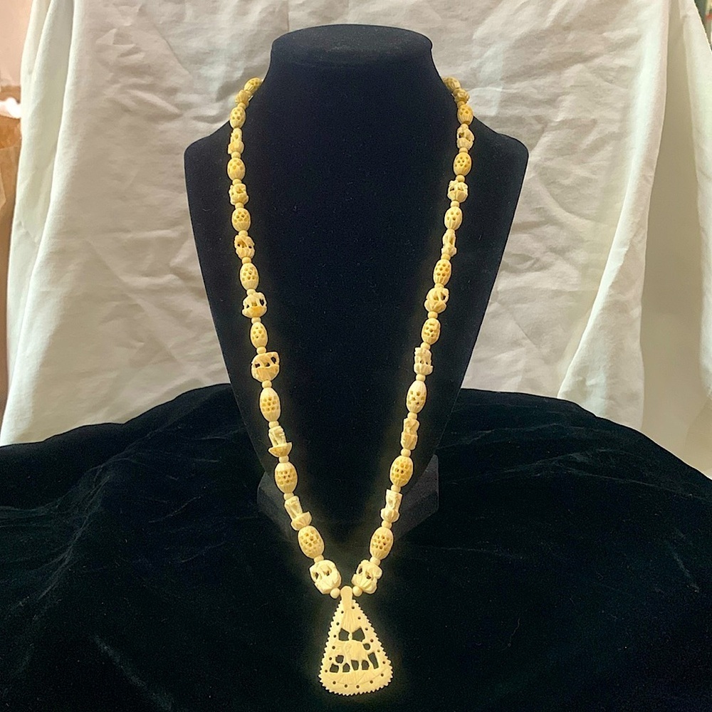 Vintage faux ivory carved elephant pendant necklace